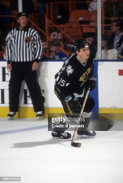 Jamie Langenbrunner of the Dallas Stars skates on the ice during an NHL game against the Los Angeles Kings on November 15, 1997 at the Great Western...