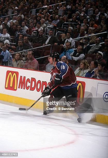 Adam Deadmarsh of the Colorado Avalanche looks to pass during an NHL game against the Philadelphia Flyers on October 28, 1999 at the Wells Fargo...
