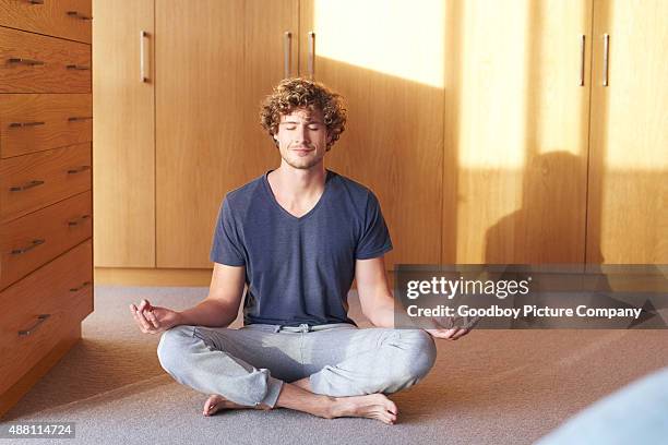 morning serenity - man doing yoga in the morning stockfoto's en -beelden