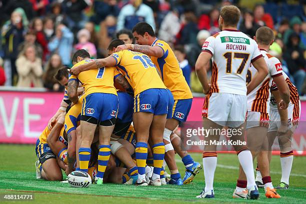 Will Hopoate of City celebrates with his is congratulated by his team mates as he celebrates scoring a try mates after scoring a try in the last...