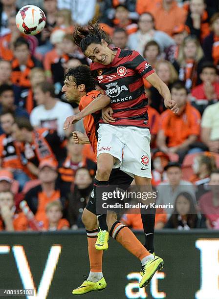 Thomas Broich of the Roar and Jerome Polenz challenge for the ball during the 2014 A-League Grand Final match between the Brisbane Roar and the...