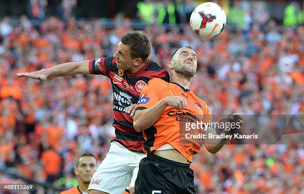 Ivan Franjic of the Roar and Brendon Santalab of the Wanderers compete for the ball during the 2014 A-League Grand Final match between the Brisbane...