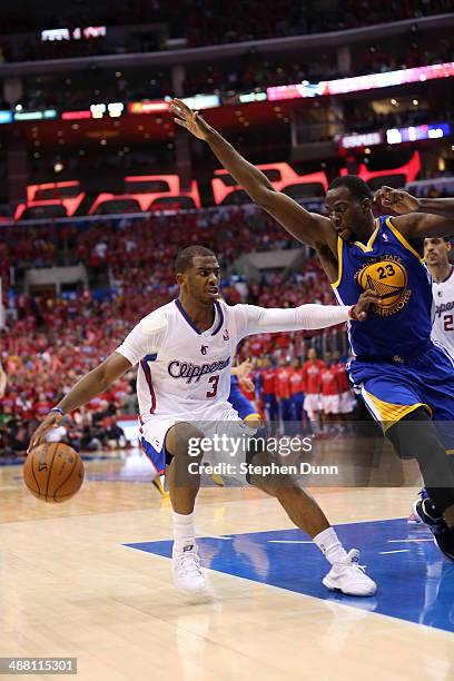 Chris Paul of the Los Angeles Clippers drives against Draymond Green of the Golden State Warriors in Game Seven of the Western Conference...