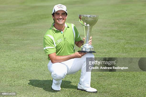 Felipe Aguilar of Chile poses with the trophy after winning The Championship at Laguna National held at Laguna National Golf & Country Club on May 4,...