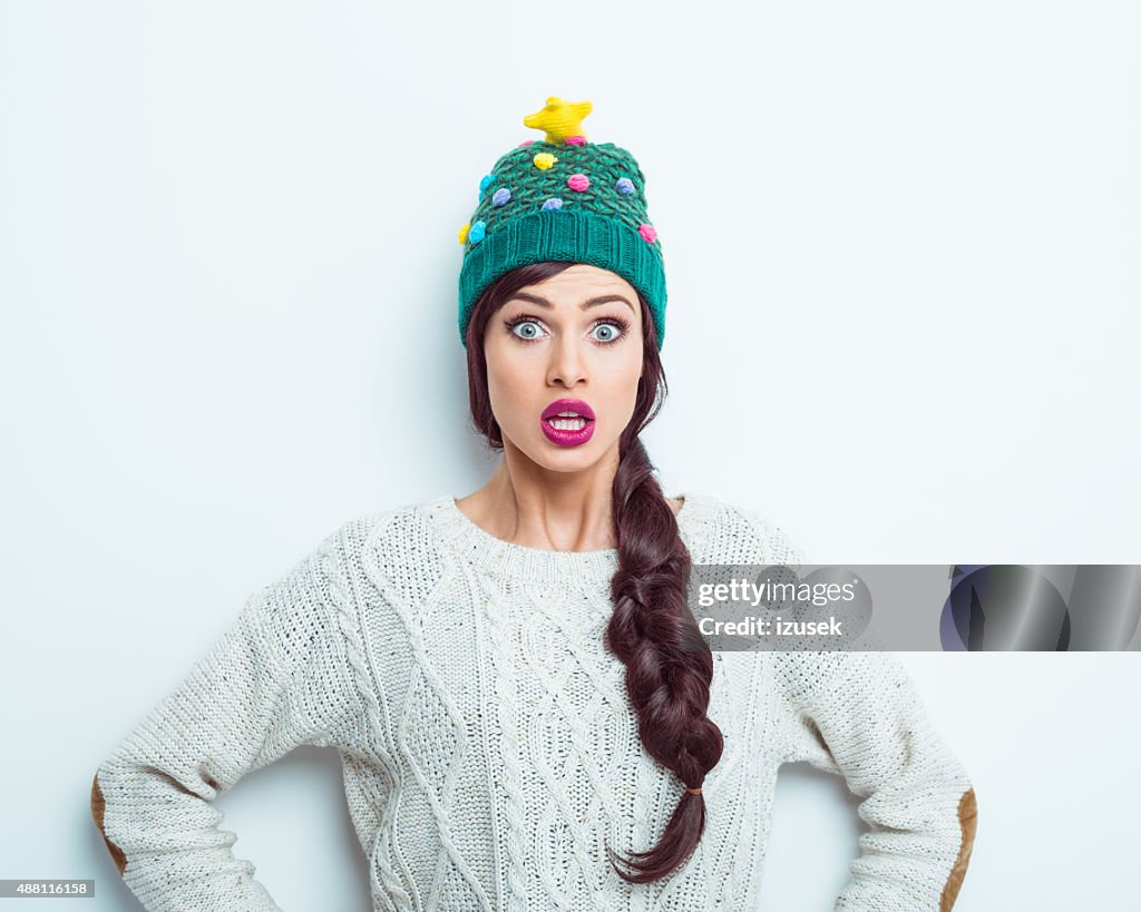 Surprised woman in winter outfit