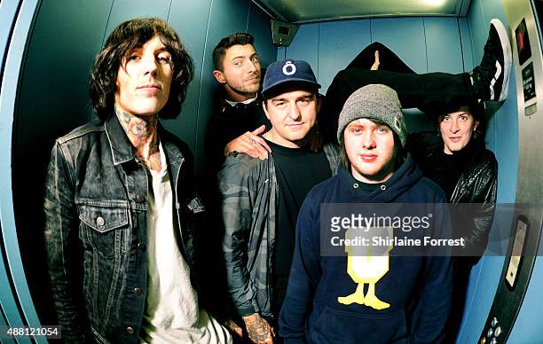 Oliver Sykes, Lee Malia, Matt Kean, Matt Nicholls and Jordan Fish of Bring Me The Horizon pose in a lift backstage after meeting fans and signing...