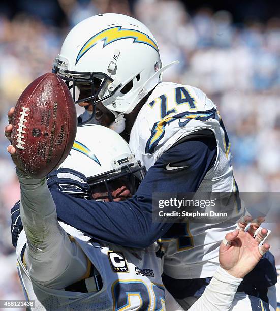 Free safety Eric Weddle is congratulated by cornerback Brandon Flowers of the San Diego Chargers after recovering a fumble by the Detroit Lions at...