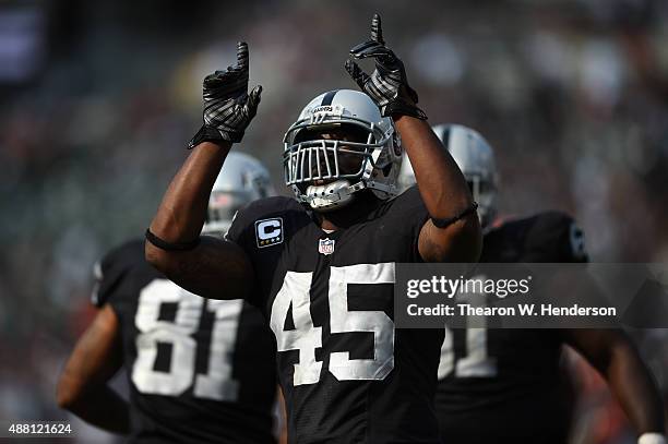Marcel Reece of the Oakland Raiders celebrates his second touchdown in the second half of their NFL game at O.co Coliseum on September 13, 2015 in...