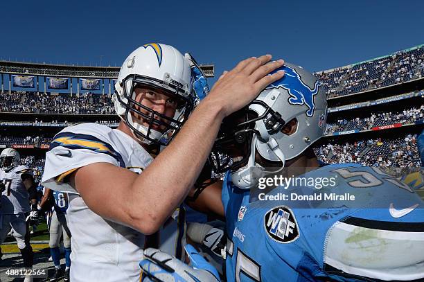 Quarterback Philip Rivers of the San Diego Chargers shakes hands with middle linebacker Stephen Tulloch of the Detroit Lions after the Chargers...