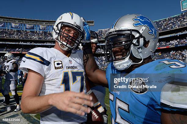 Quarterback Philip Rivers of the San Diego Chargers shakes hands with middle linebacker Stephen Tulloch of the Detroit Lions after the Chargers...