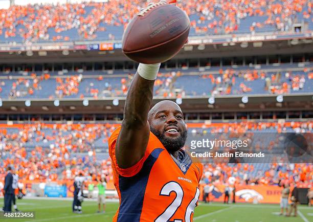 Defensive back Darian Stewart of the Denver Broncos walks off the field holding the ball in intercepted to end the game after a game between the...