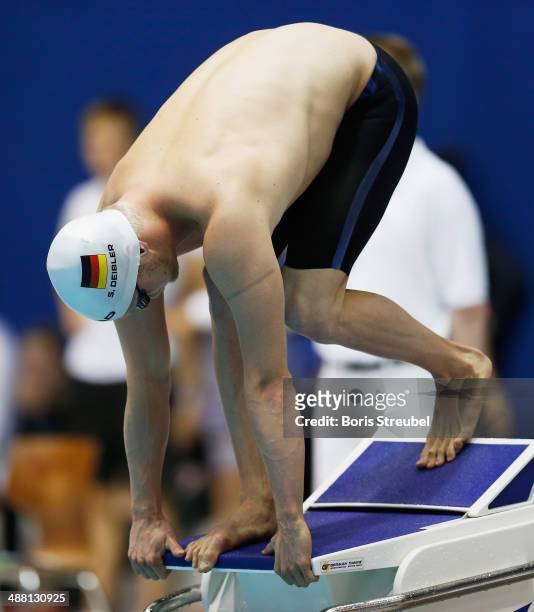 Steffen Deibler of Hamburger SC takes the start of the men's 50 m freestyle heat during day three of the German Swimming Championship 2014 at...