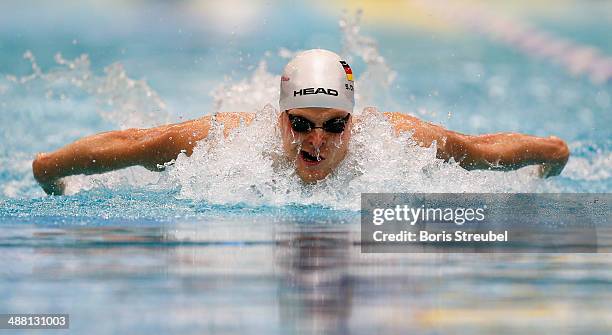 Steffen Deibler of Hamburger SC competes in the men's 100 m butterfly heat during day three of the German Swimming Championship 2014 at Eurosportpark...