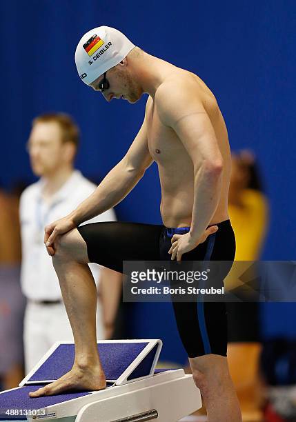 Steffen Deibler of Hamburger SC prepares for the start of the men's 50 m freestyle heat during day three of the German Swimming Championship 2014 at...