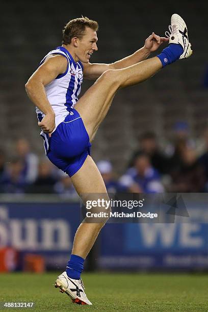 Drew Petrie of the Kangaroos kicks the ball during the round seven AFL match between the North Melbourne Kangaroos and the Gold Coast Suns at Etihad...