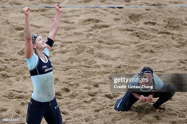 Kira Walkenhorst and Laura Ludwig of Germany celebrate beating Fan Wang and Yuan Yue of China during the Women's Final match of 2014 FIVB Shanghai...