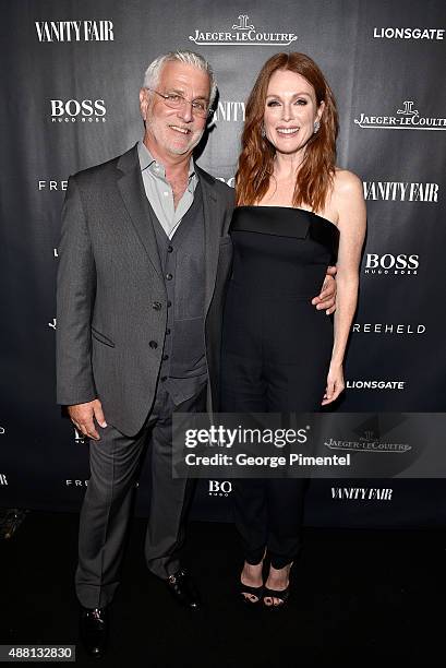 Lionsgate Motion Picture Group Co-Chair Rob Friedman and actress Julianne Moore attend the Vanity Fair toast of "Freeheld" at TIFF 2015 presented by...