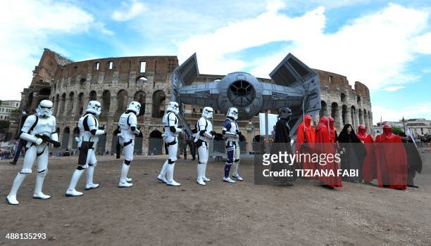 Members of the Star Wars fan club celebrate "Star Wars Day" in front of the Colosseum in central Rome on May 4, 2014. AFP PHOTO / TIZIANA FABI