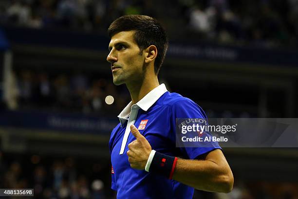 Novak Djokovic of Serbia celebrates after defeating Roger Federer of Switzerland during their Men's Singles Final match on Day Fourteen of the 2015...