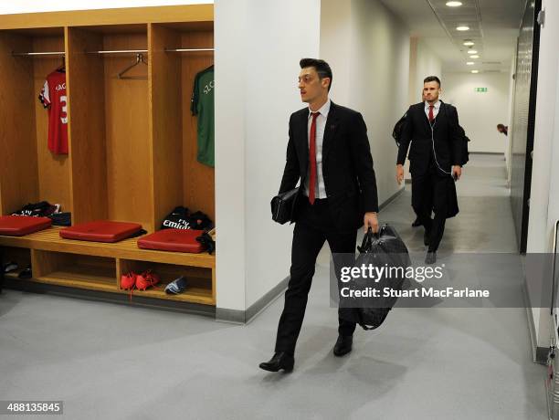 Mesut Ozil walks into the Arsenal changing room before the Barclays Premier League match between Arsenal and West Bromwich Albion at Emirates Stadium...