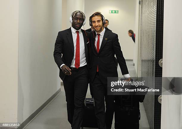 Bacary Sagna and Mathieu Flamini walk into the Arsenal changing room before the Barclays Premier League match between Arsenal and West Bromwich...