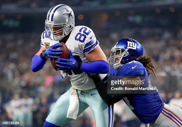 Jason Witten of the Dallas Cowboys catches a touchdown pass in front of Uani' Unga of the New York Giants in the fourth quarter at AT&T Stadium on...