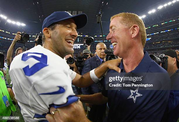 Tony Romo of the Dallas Cowboys celebrates with head coach Jason Garrett of the Dallas Cowboys after the Dallas Cowboys beat the New York Giants...