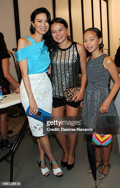 Wendi Deng Murdoch poses with her children Grace Helen Murdoch and Chloe Murdoch backstage during Diane Von Furstenberg Spring 2016 New York Fashion...