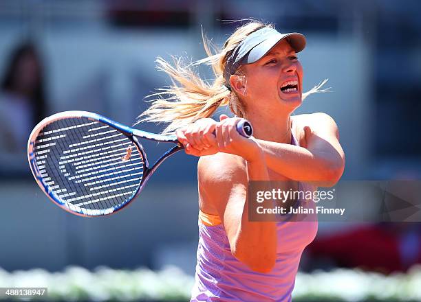 Maria Sharapova of Russia celebrates defeating Klara Koukalova of Czech Republic during day two of the Mutua Madrid Open tennis tournament at the...