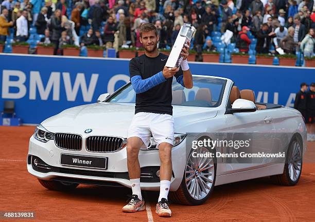 Martin Klizan of Slovakia poses with the trophy after winning the final against Fabio Fognini of Italy during the BMW Open on May 4, 2014 in Munich,...