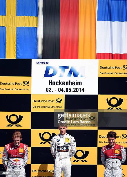 First placed Marco Wittmann of Germany and BMW Team RMG, second placed Mattias Ekstroem of Sweden and Audi Sport Team Abt Sportsline and third placed...