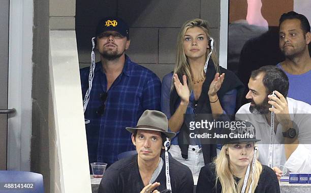 Leonardo DiCaprio, Kelly Rohrbach and Lukas attend the Men's Final on day fourteen of the 2015 US Open at USTA Billie Jean King National Tennis...