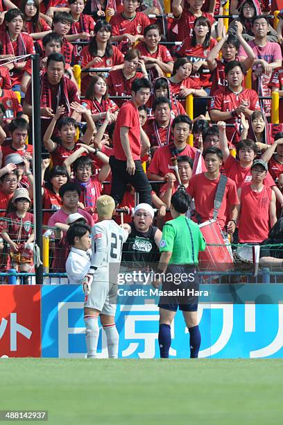 Kashima Antlers supporter throws a drumstick and Takanori Sugeno of Kashiwa Reysol returns it during the J.League match between Kashiwa Reysol and...