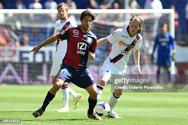 Giuseppe Sculli of Genoa CFC is challenged by Cesare Natali of Bologna FC during the Serie A match between Genoa CFC and Bologna FC at Stadio Luigi...