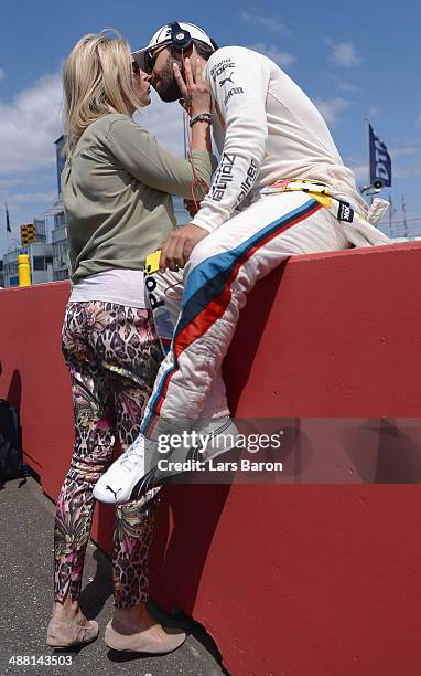 Timo Glock of Germany and BMW Team MTEK is seen with his girlfriend Isabell Reis prior to the first round of the DTM 2014 German Touring Car...