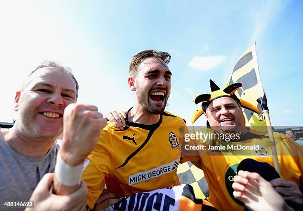 Ryan Donaldson of Cambride United celebrates with the crowd during the Skrill Conference Premier Play-Offs Semi-Final match between Cambridge United...