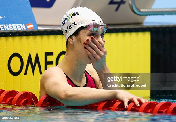 Alexandra Wenk of SG Stadtwerke Muenchen reacts after winning the women's 100 m butterfly A final during day three of the German Swimming...