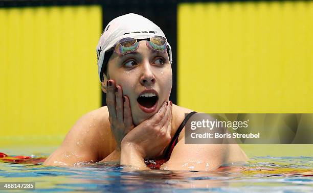 Alexandra Wenk of SG Stadtwerke Muenchen reacts after winning the women's 100 m butterfly A final during day three of the German Swimming...