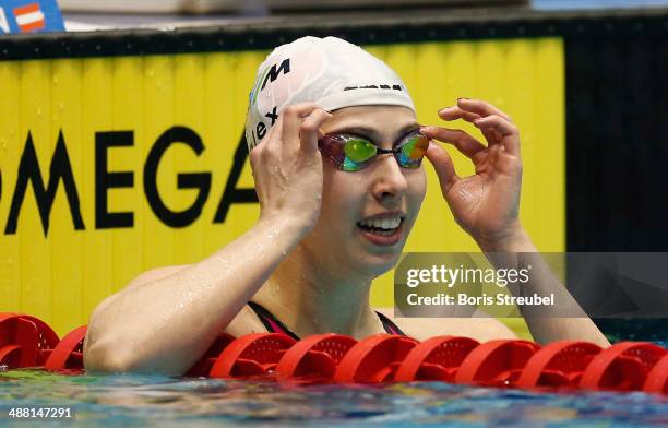 Alexandra Wenk of SG Stadtwerke Muenchen reacts after winning the women's 100 m butterfly A final during day three of the German Swimming...