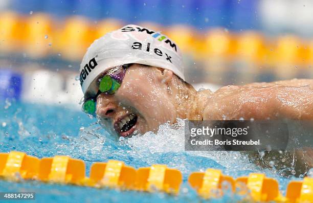 Alexandra Wenk of SG Stadtwerke Muenchen competes in the women's 100 m butterfly A final during day three of the German Swimming Championship 2014 at...