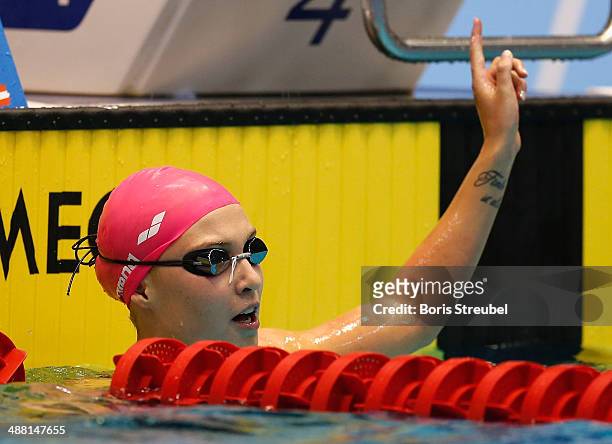 Vanessa Grimberg of SVR Stuttgart celebrates after winning the women's 200 m breaststroke A final during day three of the German Swimming...