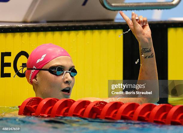 Vanessa Grimberg of SVR Stuttgart celebrates after winning the women's 200 m breaststroke A final during day three of the German Swimming...