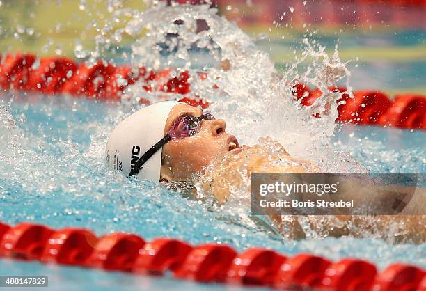 Jenny Mensing of SC Wiesbaden 1911 competes in the women's 100 m backstroke A final during day three of the German Swimming Championship 2014 at...