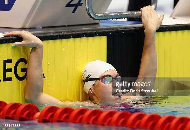 Jenny Mensing of SC Wiesbaden 1911 reacts after winning the women's 100 m backstroke A final during day three of the German Swimming Championship...