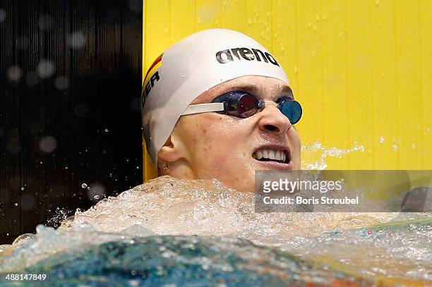 Christian Diener of PSV Cottbus 90 reacts after the men's 100 m backstroke A final during day three of the German Swimming Championship 2014 at...