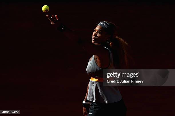 Serena Williams of USA serves to Belinda Bencic of Switzerland during day two of the Mutua Madrid Open tennis tournament at the Caja Magica on May 4,...