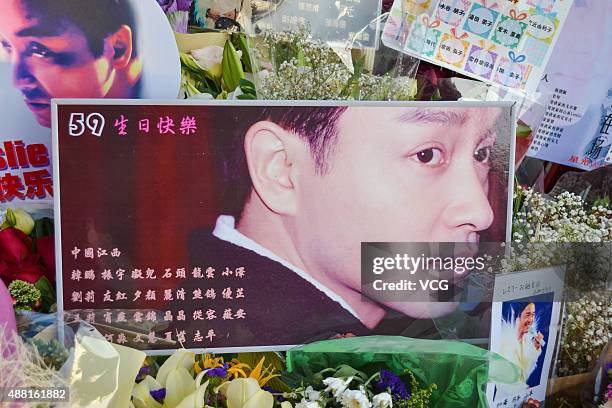 Flowers and posters are presented to mourn singer and actor Leslie Cheung at Avenue of Stars on September 13, 2015 in Hong Kong. Cheung died aged 46...