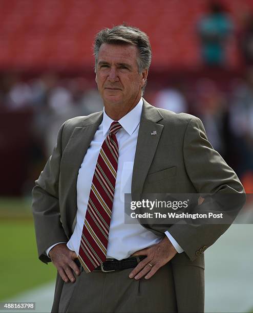 Washington Redskins team president Bruce Allen watches his team warm up prior to action against the Miami Dolphins at FedEx field on September 13,...