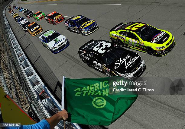 Brian Scott, driver of the Shore Lodge Chevrolet, and Paul Menard, driver of the Richmond / Menard's Chevrolet, lead the field to start the NASCAR...