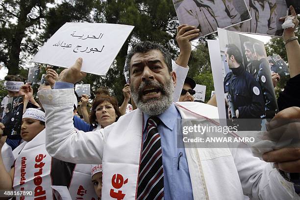 Maurice, the brother of Georges Ibrahim Abdallah, takes part in a demonstration outside the French embassy in Beirut on April 30, 2010 to call on...